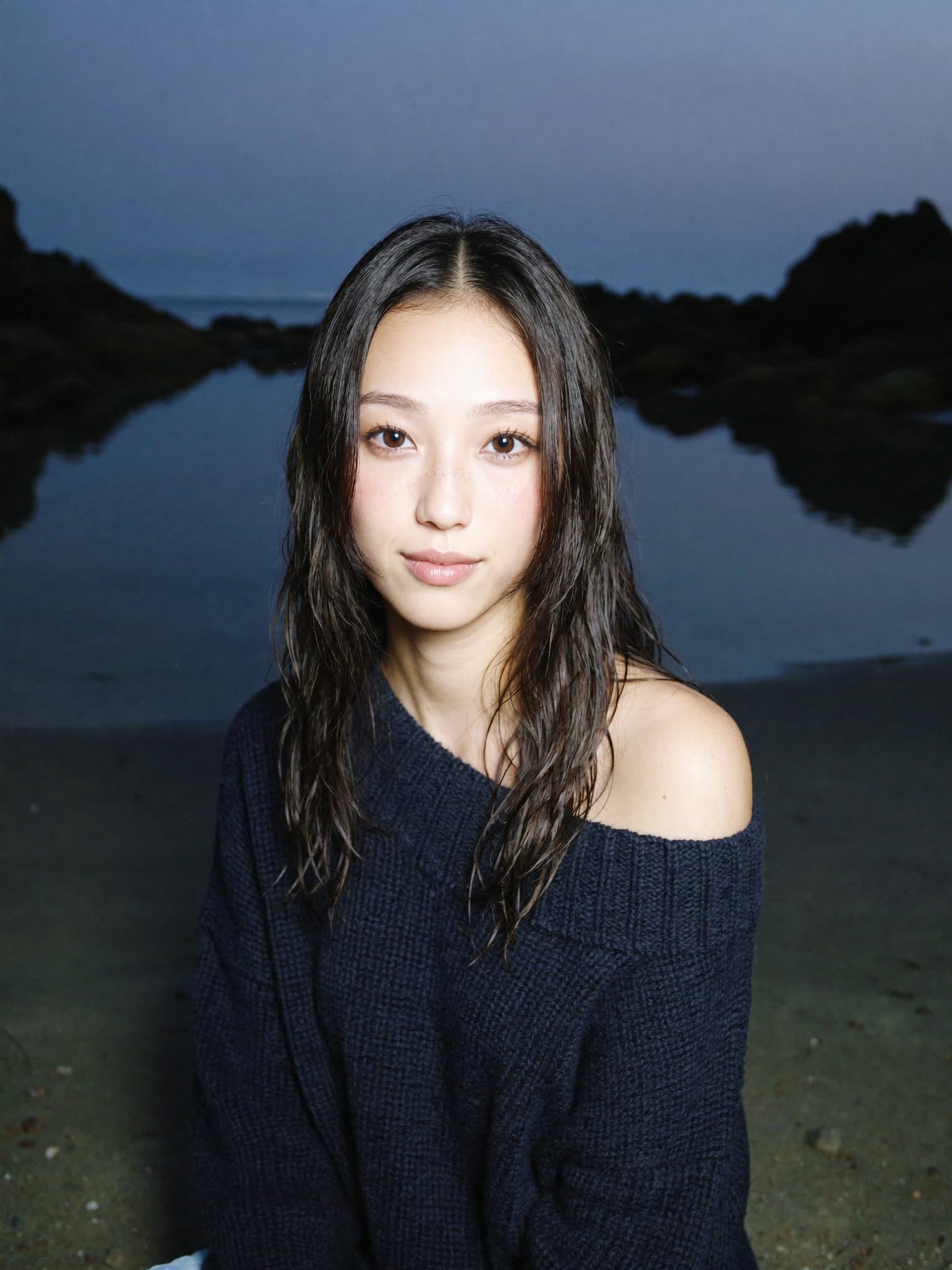 mira ayase at golden hour by a still lake, soft twilight portrait in a navy knit sweater