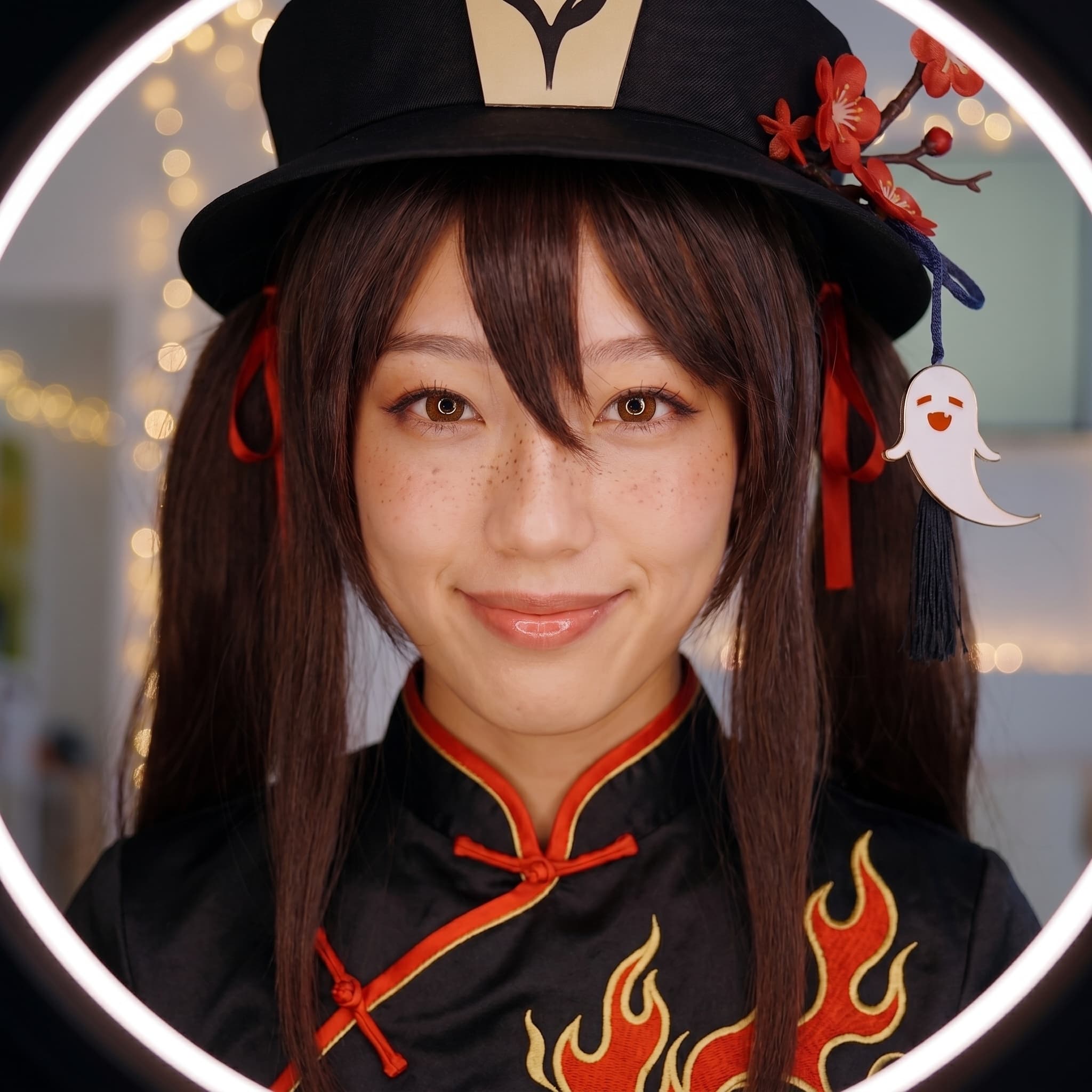 mira in hu tao cosplay (genshin impact) — twin braided pigtails, plum-blossom hat, mischievous half-smile